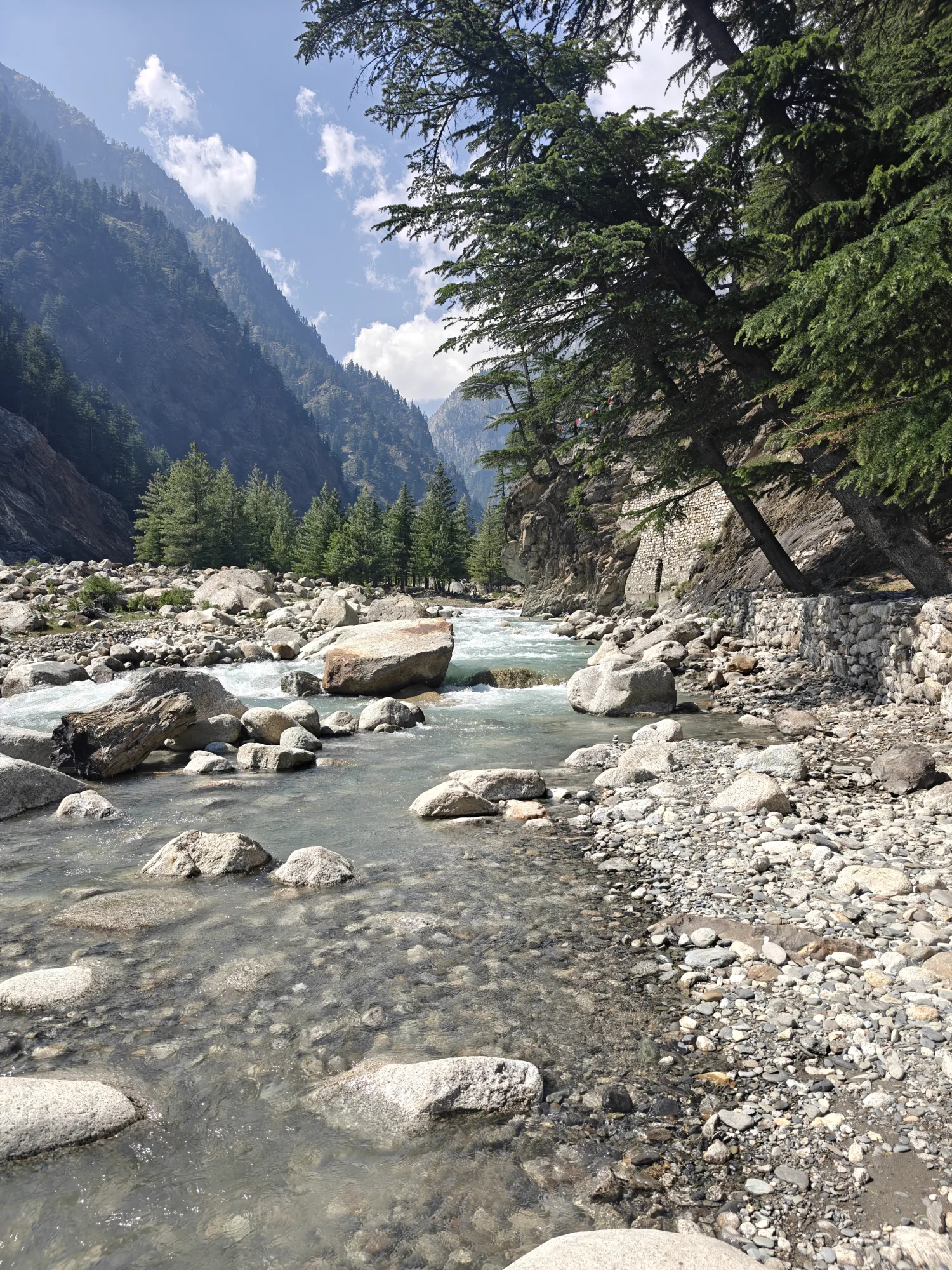 The Bhagirathi river flowing past Bagori, with snow peaks on the horizon